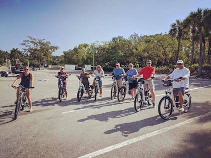 Friends riding e-bikes in Naples, Florida