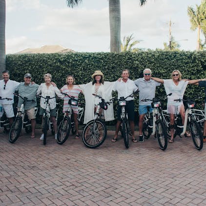 Friends riding e-bikes in Naples, Florida